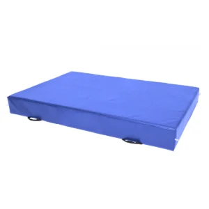 Blue rectangular crash mat with zip-closed reinforced PVC cover, mesh breather holes, and carry handles, designed for indoor gymnastics or sports use.