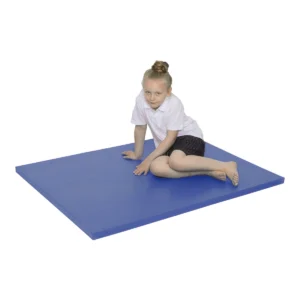 Child sitting on a blue blended gym mat, highlighting its low profile and firmer, stable surface for PE and gym use.