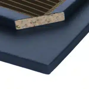 Close-up of a Deluxe Gym Mat showing a 10lb chip foam core with a smooth blue bonded PVC cover and welded corners.