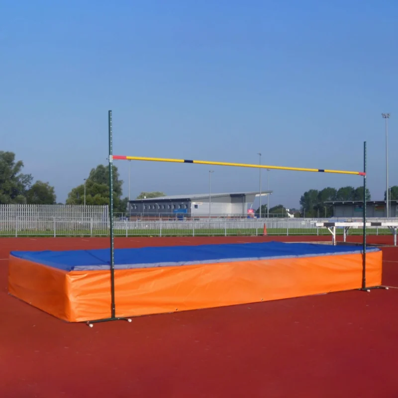 GMLM010 Seven-module school high jump landing area set up outdoors, featuring a bright orange and blue PVC cover with an assembled crossbar.