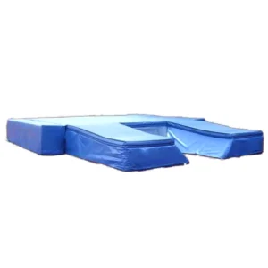 Blue pole vault landing mat system on white background